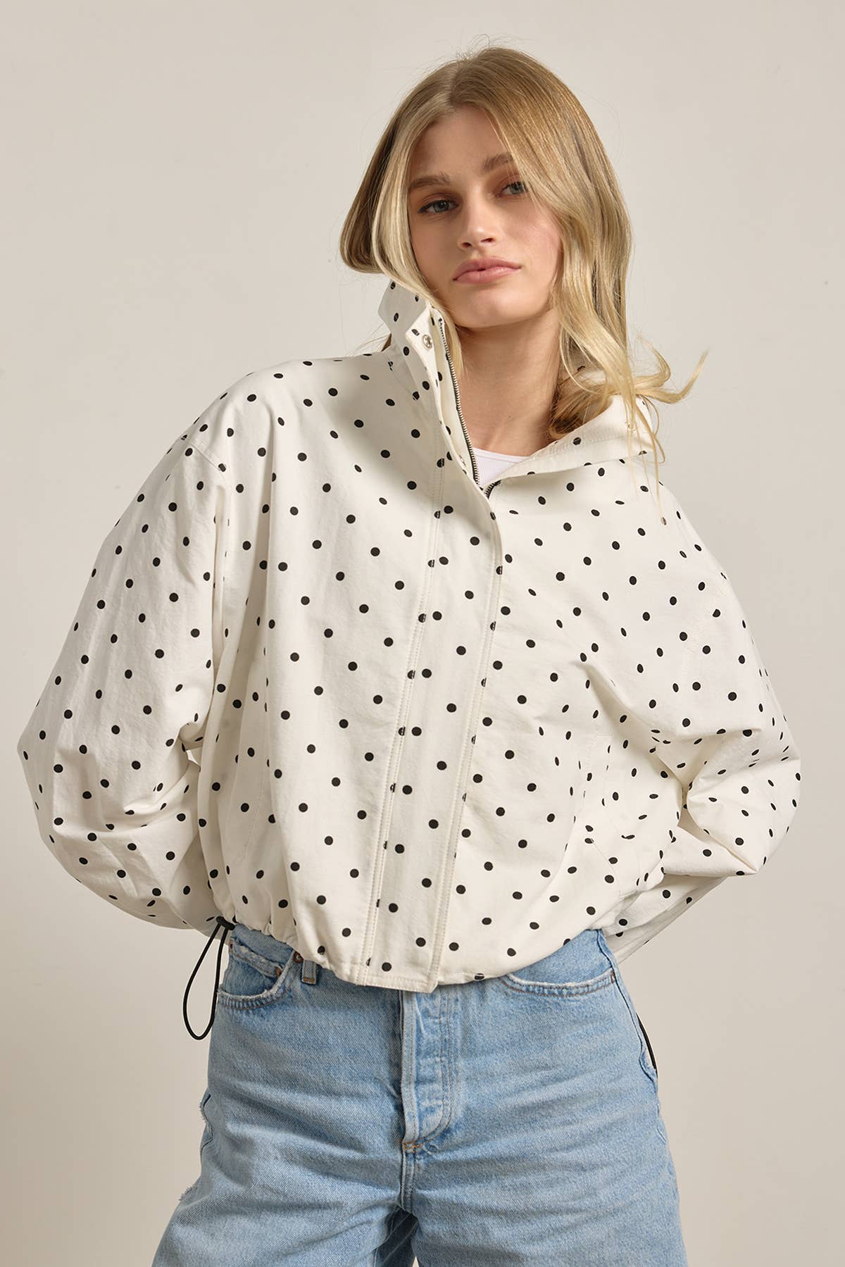 Polka Dot High Neck Drawstring Pullover Jacket in cream with black dots