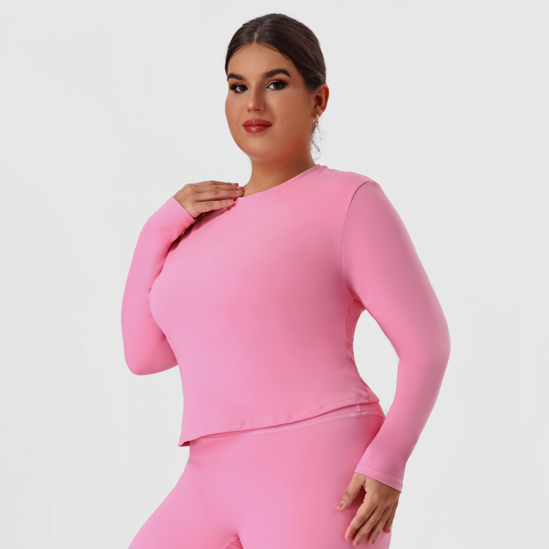 Plus size women's crew neck fitted long sleeve tee in pink